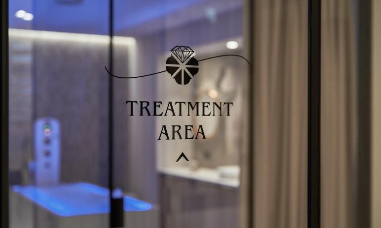 Treatment area with soft lighting and modern decor.